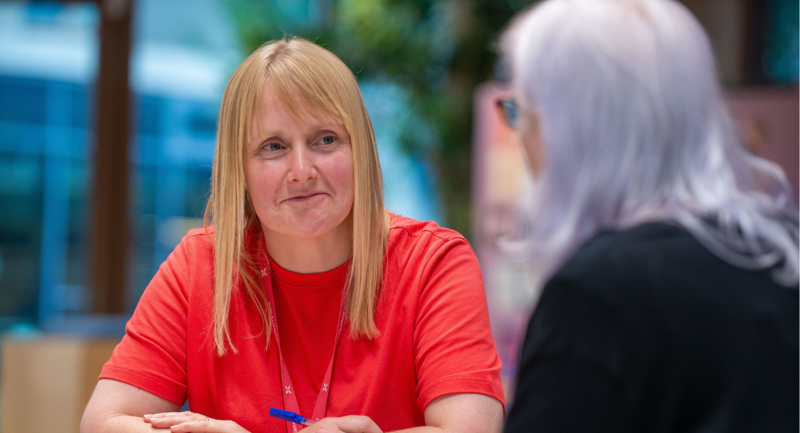 A member of of Advocacy team chats with a client