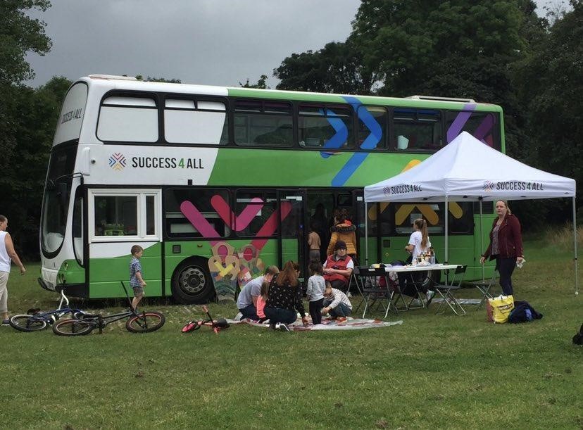 Success4All bus with children and adults around it